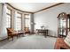 Bright living room with large windows, neutral carpeting, and elegant decor at 225 Yorkshire E Blvd, Indianapolis, IN 46229