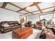 Cozy living room features a coffered ceiling, hardwood floors, and comfortable seating at 225 Yorkshire E Blvd, Indianapolis, IN 46229