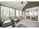Relaxing sunroom with natural light, comfortable seating, and access to the outdoors at 225 Yorkshire E Blvd, Indianapolis, IN 46229