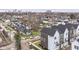 Aerial view of newly-built homes in a residential neighborhood with a city skyline in the distance at 2418 Winthrop Ave, Indianapolis, IN 46205