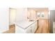 Close-up of a kitchen island with stainless steel appliances and white cabinets at 2418 Winthrop Ave, Indianapolis, IN 46205