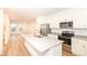 Modern kitchen featuring an island, stainless steel appliances, and white cabinetry at 2418 Winthrop Ave, Indianapolis, IN 46205