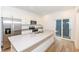 Well-lit kitchen featuring stainless steel appliances, white cabinetry and a central island with sink at 2418 Winthrop Ave, Indianapolis, IN 46205