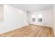 Open-concept living space with hardwood floors and recessed lighting at 2418 Winthrop Ave, Indianapolis, IN 46205
