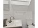Bright bathroom with white subway tile, a pedestal sink, modern fixtures, and a sleek, clean design at 25 N Wayburn St, Indianapolis, IN 46229