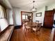 Dining room showing hardwood floors and view into the living area at 25 N Wayburn St, Indianapolis, IN 46229