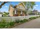 Charming two-story home with a classic white picket fence and inviting front porch, perfect for enjoying the outdoors at 25 N Wayburn St, Indianapolis, IN 46229