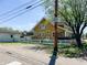 Cozy home with a white picket fence, side garage, and healthy green lawn, perfect for families at 25 N Wayburn St, Indianapolis, IN 46229