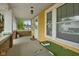 Inviting front porch featuring brick accents, ample space, and a warm welcome with a cozy and relaxing atmosphere at 25 N Wayburn St, Indianapolis, IN 46229
