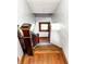 Classic stairway features natural wood steps, decorative banister, and a window landing at 25 N Wayburn St, Indianapolis, IN 46229