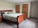 Cozy bedroom with plush carpeting, warm wood accents, and neutral paint, a relaxing space at 2550 16Th St, Columbus, IN 47201