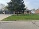 Charming brick home with a well-manicured lawn, mature tree, and a spacious two-car garage at 2550 16Th St, Columbus, IN 47201
