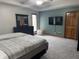 Spacious main bedroom with plush carpeting, ceiling fan, and an ensuite bathroom at 2550 16Th St, Columbus, IN 47201