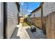 Cozy backyard showcasing a fire pit area, gravel, privacy fence, and freshly seeded lawn for outdoor relaxation at 257 N Tacoma Ave, Indianapolis, IN 46201