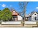 Two-story home with a modern exterior, attractive wooden porch, and landscaping at 257 N Tacoma Ave, Indianapolis, IN 46201