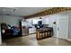 Open kitchen with stainless steel appliances, a breakfast bar, white cabinets, and modern finishes at 257 N Tacoma Ave, Indianapolis, IN 46201