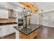 Spacious kitchen with a large island, modern lighting, stainless steel appliances, and hardwood floors at 257 N Tacoma Ave, Indianapolis, IN 46201