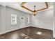 Bright living room featuring hardwood floors, modern lighting, white trim and baseboards and neutral paint at 257 N Tacoma Ave, Indianapolis, IN 46201