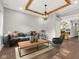 Inviting living room featuring a comfortable blue sofa and a unique wooden-beamed ceiling at 257 N Tacoma Ave, Indianapolis, IN 46201