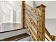 Staircase featuring wood railing and hardwood treads leading to the upper level at 257 N Tacoma Ave, Indianapolis, IN 46201