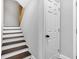 Staircase with hardwood treads and white risers leading to the upper level of the home at 257 N Tacoma Ave, Indianapolis, IN 46201