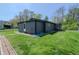 A spacious backyard with green grass surrounds the exterior of the home, offering a serene outdoor space at 2658 S Rybolt Ave, Indianapolis, IN 46241