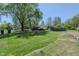 Large backyard with a fire pit, above-ground pool, and plenty of space for recreation and relaxation at 2658 S Rybolt Ave, Indianapolis, IN 46241