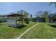 Spacious backyard with a play structure, gazebo, shed, and trampoline, perfect for outdoor fun at 2658 S Rybolt Ave, Indianapolis, IN 46241