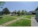 Spacious backyard featuring a swing set, gazebo, trampoline, and manicured green space at 2658 S Rybolt Ave, Indianapolis, IN 46241