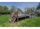 Backyard featuring an above-ground pool, deck, and staircase, offering outdoor relaxation and recreation at 2658 S Rybolt Ave, Indianapolis, IN 46241