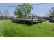 Backyard showcasing an above-ground pool with an elevated wooden deck, perfect for summer enjoyment at 2658 S Rybolt Ave, Indianapolis, IN 46241