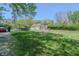 Expansive backyard featuring an above-ground pool, fire pit, and ample green space for outdoor activities at 2658 S Rybolt Ave, Indianapolis, IN 46241