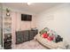 Bright bedroom featuring decorative pink accents, modern storage drawers and soft, plush carpeting at 2658 S Rybolt Ave, Indianapolis, IN 46241