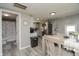 Modern kitchen with stainless steel appliances, light countertops, and access to the bathroom at 2658 S Rybolt Ave, Indianapolis, IN 46241