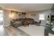 The inviting living room is furnished with a large, comfortable sectional couch and stylish decor at 2658 S Rybolt Ave, Indianapolis, IN 46241