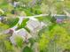 Sprawling estate featuring mature trees, curved drive, and professionally landscaped grounds at 2733 Foxborough Dr, Greenwood, IN 46143