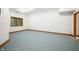 Unfinished basement area with a window and wood trim for customizable living space at 2733 Foxborough Dr, Greenwood, IN 46143