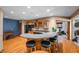 Basement area with a wet bar, wood floors, a pool table, and an exercise area at 2733 Foxborough Dr, Greenwood, IN 46143