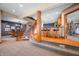 Basement with curved staircase, wet bar, and exercise area in a multi-level open floor plan at 2733 Foxborough Dr, Greenwood, IN 46143
