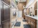 Bright bathroom featuring double sinks with granite countertops, a cabinet, and an updated glass shower at 2733 Foxborough Dr, Greenwood, IN 46143