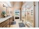 Spacious bathroom featuring double sinks with granite countertops and tile floors, plus an adjacent glass shower at 2733 Foxborough Dr, Greenwood, IN 46143