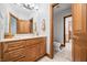 Bathroom vanity with a large mirror, a towel rack, and a toilet in a separate room at 2733 Foxborough Dr, Greenwood, IN 46143