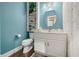 Well-lit bathroom with white vanity, oval mirror, and built-in shelves at 2733 Foxborough Dr, Greenwood, IN 46143