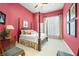 Elegant bedroom featuring a four-poster bed, plush bedding, and soft natural light, creating a serene retreat at 2733 Foxborough Dr, Greenwood, IN 46143