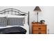 Cozy bedroom showcases decorative pillows on an iron bed frame and a vintage bedside telephone at 2733 Foxborough Dr, Greenwood, IN 46143
