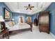 Bedroom featuring a tray ceiling and beautiful trim, plus abundant closet space at 2733 Foxborough Dr, Greenwood, IN 46143