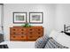 Bedroom with a view of a dresser with matching artwork hanging above the headboard at 2733 Foxborough Dr, Greenwood, IN 46143