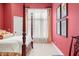 Bedroom featuring canopy bed, neutral carpet, and colorful walls at 2733 Foxborough Dr, Greenwood, IN 46143