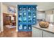 Stylish blue built-in cabinet for storage and display, connecting the kitchen and dining areas at 2733 Foxborough Dr, Greenwood, IN 46143