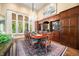 Formal dining room showcasing a large table, chairs, ornate chandelier, and built-in wood cabinetry at 2733 Foxborough Dr, Greenwood, IN 46143